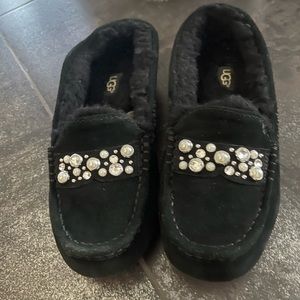 UGG Women’s moccasin slippers with pearls and rhinestones.